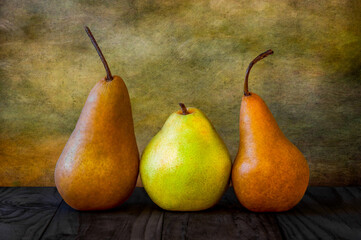 still life of a trio of pears with a textured background © Robert Paulus