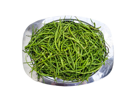 Radish pods, also known as "Moongra" in Hindi, are basically radish flowers or seed pods that resemble a mixture of beans and radish. Radish pods in a Silver Tray isolated on a white background.