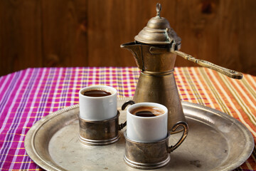 still life with a middle eastern coffee set, on wooden table