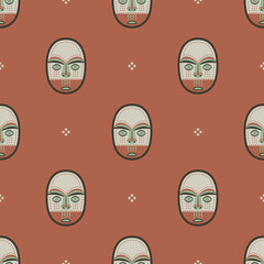 Seamless ethnic pattern with Native American masks of Eskimo or Inuit Indians. Ethnic Indigenous design. On red background.