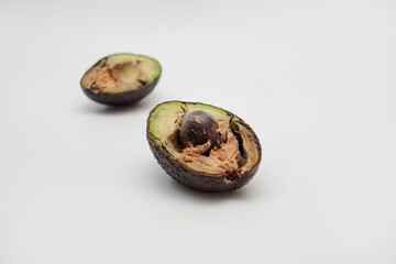 cut rotten avocado. recycling spoiled food