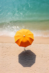Yellow sunshade umbrella on an empty beach by the ocean. Aerial view. AI generated