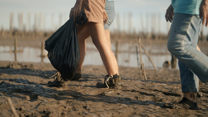 Group of volunteers cleaning on the beach