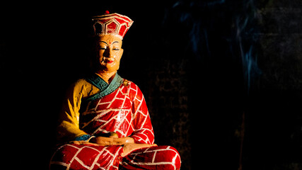 Statue sitting in a cave in the marble mountains of Vietnam