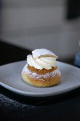 Swedish Semla. A traditional scandinavian cream filled cardamom bun with almond paste.