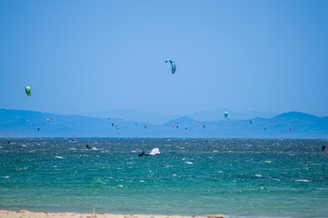 Kitesurfing on Valdevaqueros beach, Gibraltar Strait in Tarifa, Spain