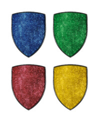 Colorful medieval metal shields isolated on white background