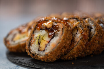 Perfectly prepared sushi, Sushi background, Eating sushi with dark soy sauce. Takeaway lunch box