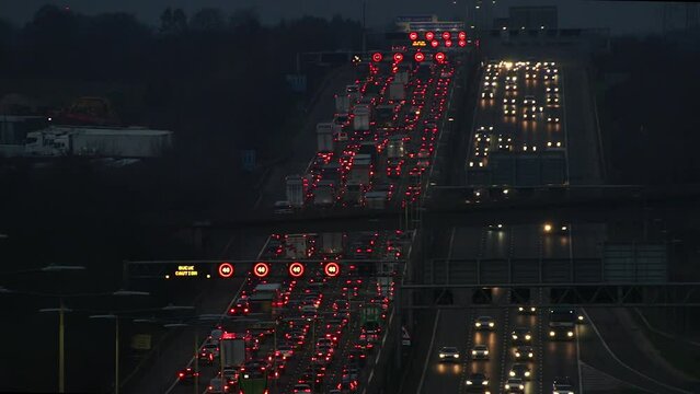 Luton, UK - February 11, 2024: Heavy evening traffic on busiest British motorway M1 near town Luton caused by long term roadworks on the motorway between junction 10 and 11.