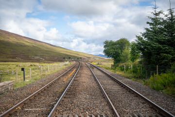 Fototapeta na wymiar Two rail tracks in the countryside. High quality photo