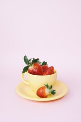 Strawberries in yellow cup 