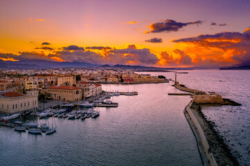 Chania with the amazing lighthouse, mosque, venetian shipyards, at sunset, Crete, Greece. - 733455155