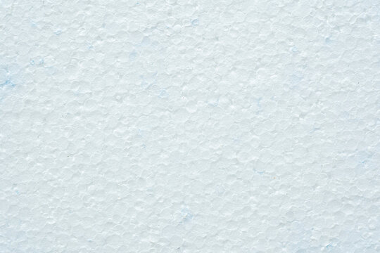 Simple white flat piece of styrofoam material structure background texture, seen from above, top view closeup detail shot, nobody Plain blank insulation styrofoam part backdrop, copy space, no people