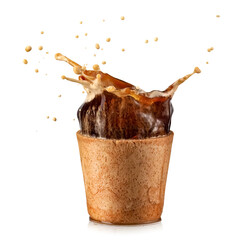 Espresso coffee splash from an edible wafer cup on white background - 733468328