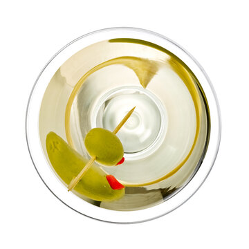 Martini cocktail with a green olive, top view on white background