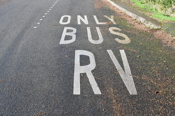 Only bus and RV parking painted on parking lot cement.