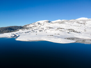 Fototapeta na wymiar Winter view of Rila mountain around Belmeken Dam, Bulgaria