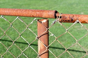 Old rusted chain-link fence.