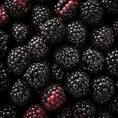 A close-up view of a group of ripe, vivid Blackberry with a deep, textured detail.