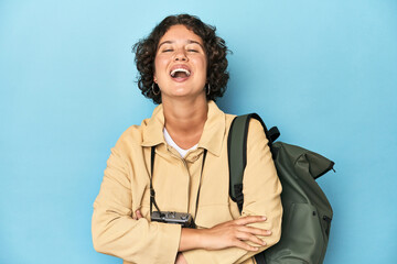 Young traveler woman with vintage camera laughing and having fun.