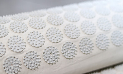 Close-up of orthopedic acupressure mat for self health massage at home and indoors