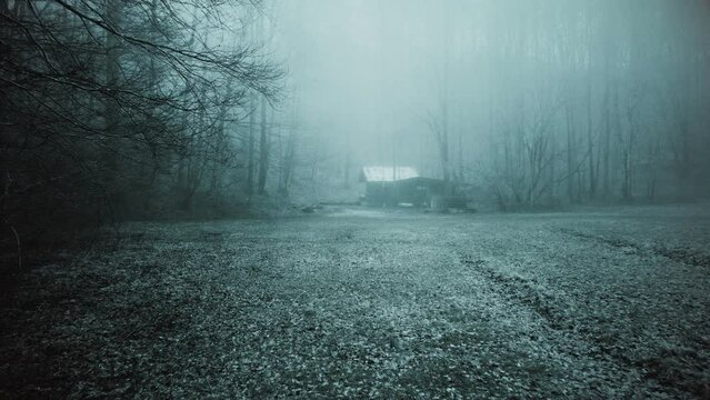 Abandoned haunted farm house in the misty forest