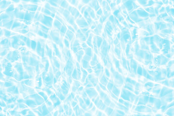 Water surface. Bluewater waves on the surface ripples blurred. Defocus blurred transparent blue colored clear calm water surface texture with splash and bubbles. Water waves with shining pattern.