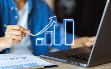 Financial success and business growth Human hand points to increase in wealth and economic progress. More stocks, funds and sales. exchange rate concept