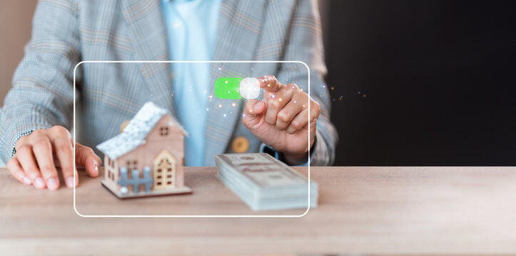 house and pile of money ,insurance concept,coverage ,Investing, real estate, and home mortgages, savings, for financial freedom, immersive touch screen, copy space.