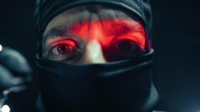 Thief With Balaclava Is Breaking The Door Of A Bank Safe