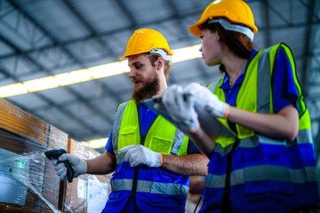 operation workers checking and inspecting cargo for stack items for shipping. males worker checking the store factory. industry factory warehouse. Worker Scanning Package In Warehouse.