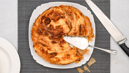 Phyllo dough pie close-up on a white plate