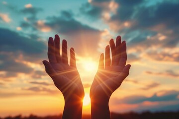 Raised hands in worship to sunset sky. Christian faith concept.