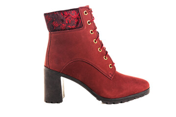 red of suede women's half-boots with high heels on a white background. Stylish demi-season women's shoes.
