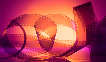 color abstract background with film strip. film festival film production announcements premieres...