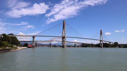 Mighty river with numerous bridges in a sunny day