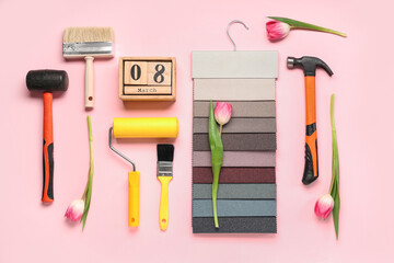 Composition with decorator's tools, fabric samples and tulip flowers on pink background