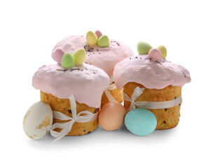 Delicious Easter cakes and painted eggs on white background
