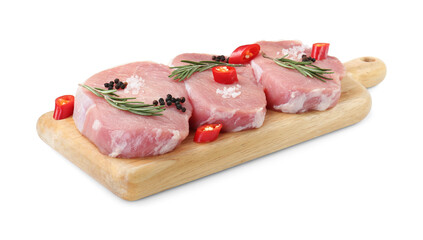 Wooden board with pieces of raw pork meat and spices isolated on white