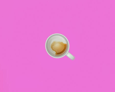 Overhead view of a nearly empty cup of coffee or tea