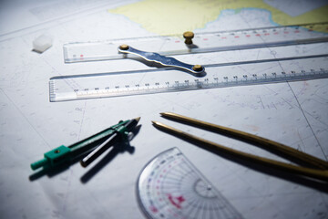 Look for maps before starting a voyage to determine sea navigation routes and navigation equipment such as calipers and rulers