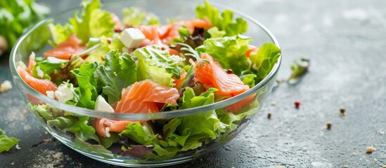 A detailed shot of a vibrant salad featuring an assortment of fresh leaf vegetables and other natural ingredients in a glass bowl on a beautifully set table.