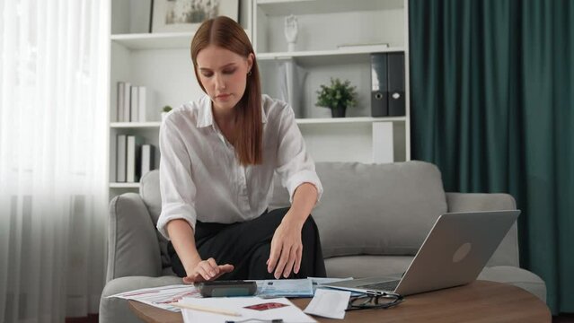 Woman calculate debt pile of bills from online shopping on internet marketplace as modern lifestyle and use credit card for online payment from wallet protected by prim cyber security software