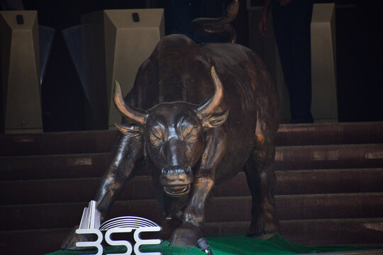 Picture of a bull and logo of Bombay stock exchange. Share market, Dalal street, rise, fall, index, fund, profit, loss, companies, bear, BSE, NSE, SEBI, law, broker
