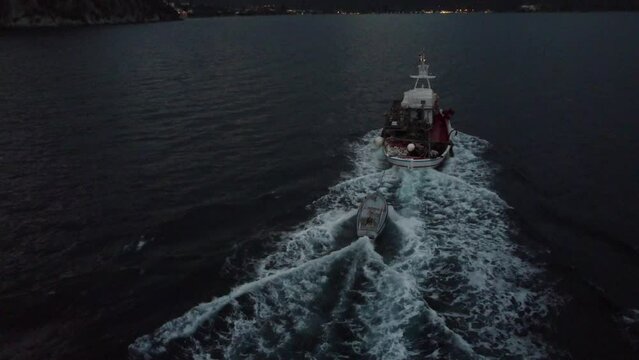 This footage was made with a drone, with a small fishboat in the frame before the storm