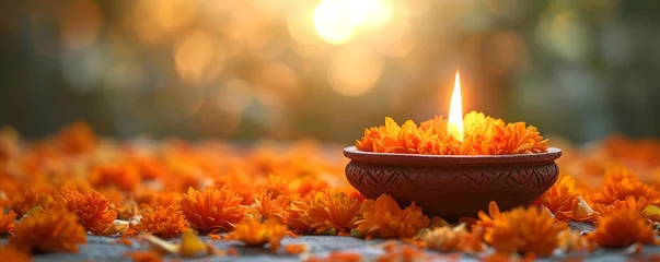 Fotobehang Traditional Indian clay oil lamp burning and marigold flowers. Ugadi, Gudi Padwa, Diwali festival concept. Hindu New Year celebration. Religion and ethnic concept. For banner, greeting card, poster © Melanthe