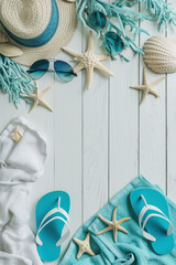 Top view flat lay Summer holiday vacation concept, flip flops, sunglasses, hat, starfish, on white wood background