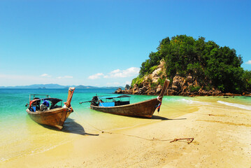 Fototapeta na wymiar Traditional long tail boats on the beach, Andaman Sea, Thailand