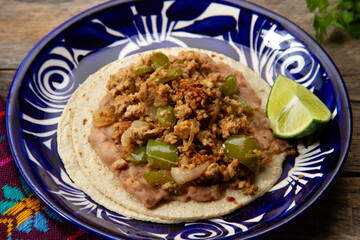 Savory delight: Ground pork tacos with peppers and beans