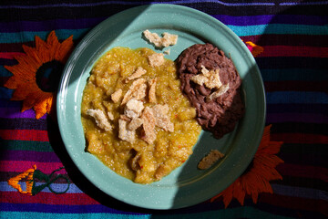 Mexican food; Chicharron with green sauce and refried beans